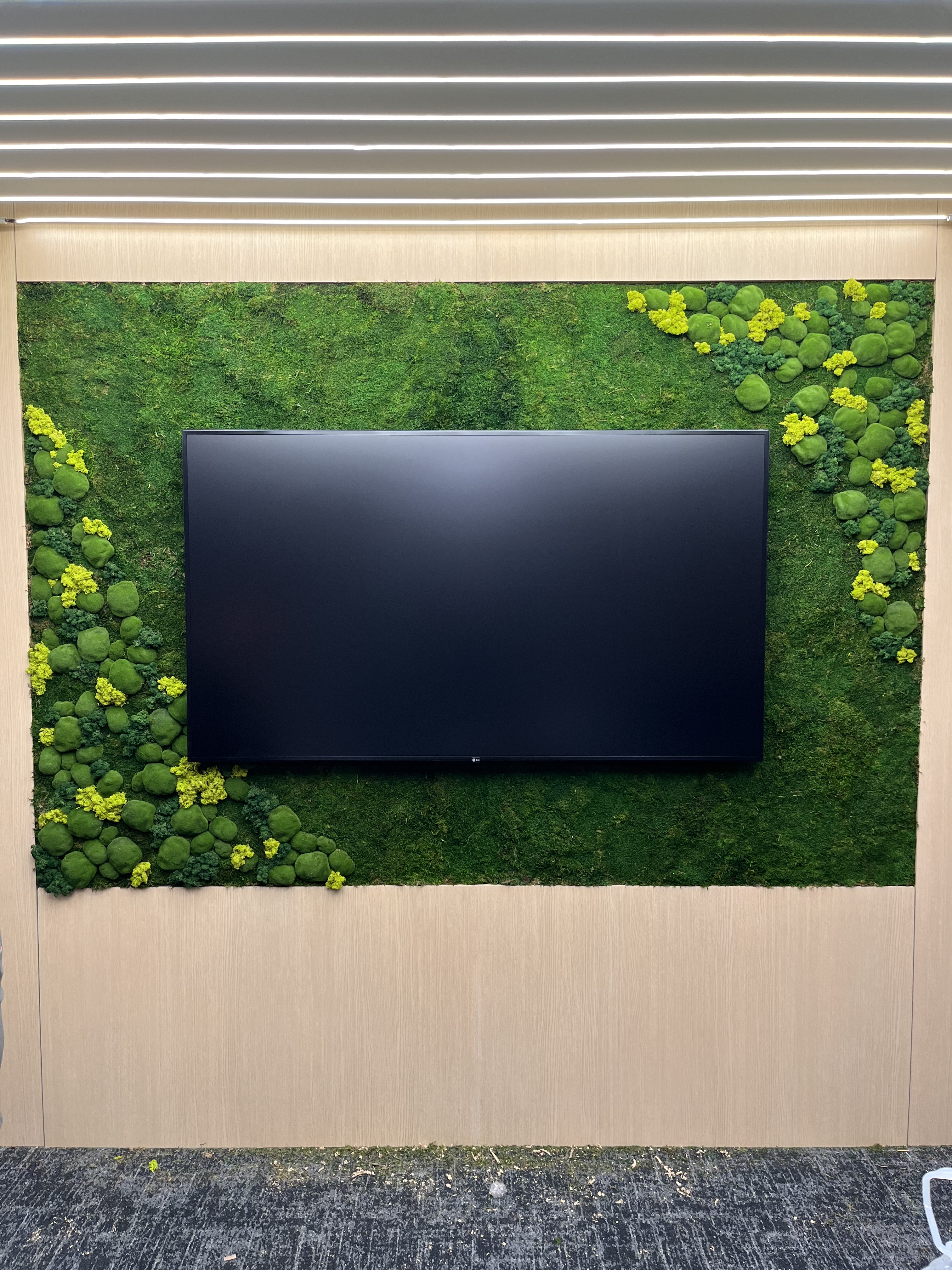Premium residential TV wall installation with clean finish and modern wood media wall
